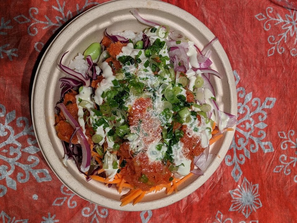 Printed menu beside fresh bowl options